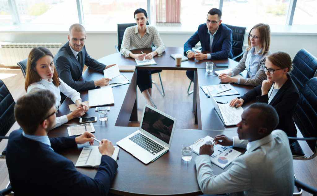 Diverse group of business people having a discussion in a corporate board room